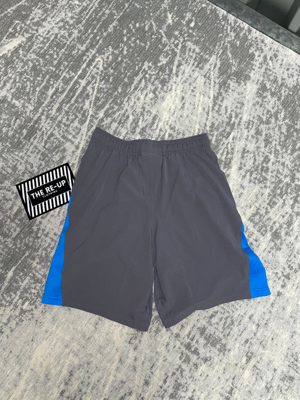 Buy Under Armour Men's UA Speedpocket 7-Inch Shorts Blue in KSA -SSS